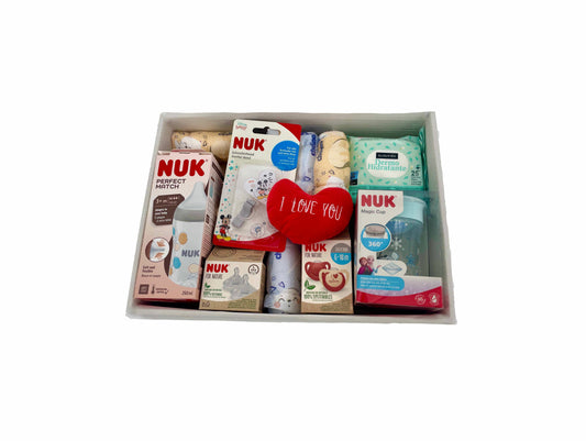 Canastilla de regalo para recién nacido MomentosGourmet con biberones, chupetes y productos de cuidado NUK en cesta