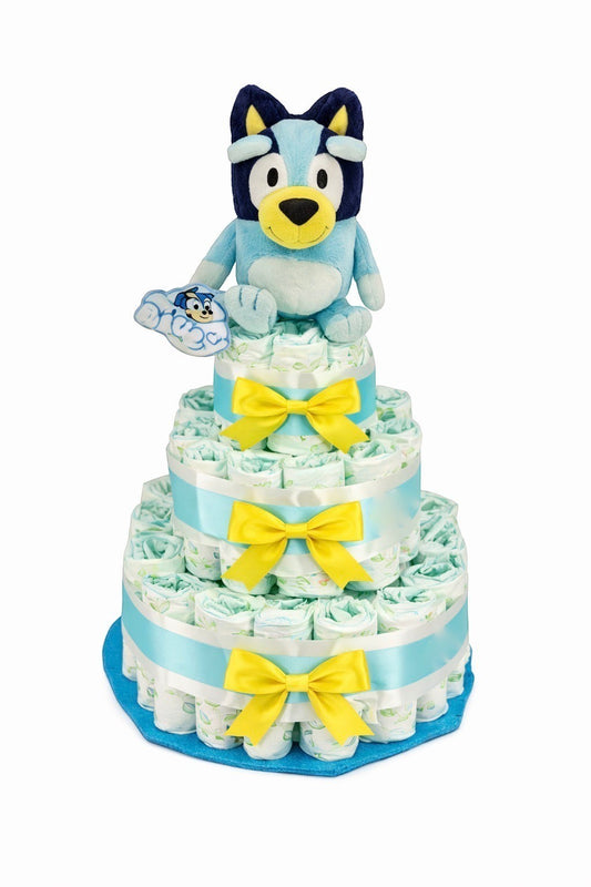 Tarta de pañales MomentosGourmet de Bluey con peluche oficial, lazos amarillos y base azul, regalo ideal para bebés.